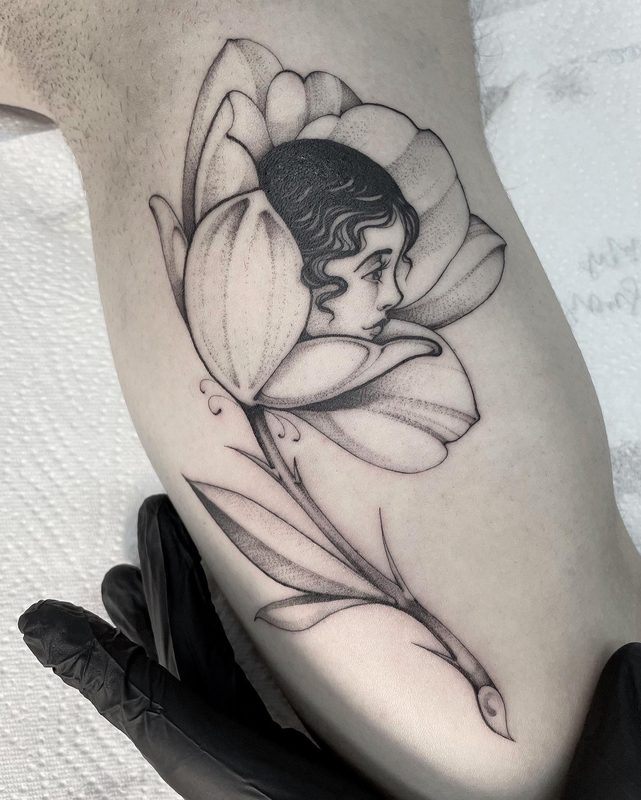 Fine line flower portrait tattoo