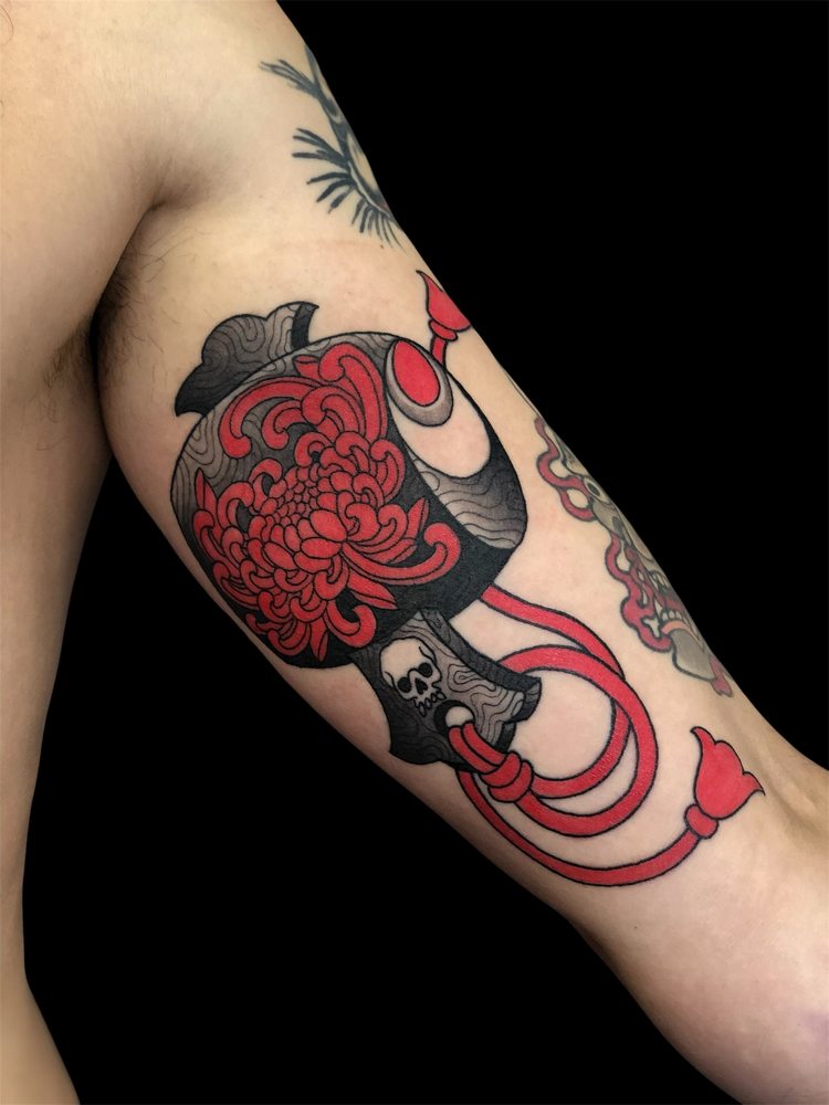 Japanese chrysanthemum and temple bell tattoo
