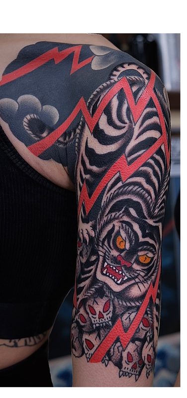 Traditional tiger sleeve with red lightning bolt