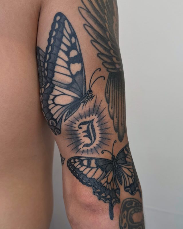 Traditional black and grey butterfly sleeve