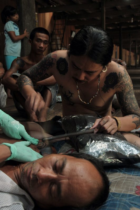 Traditional Borneo hand-tap tattooing session
